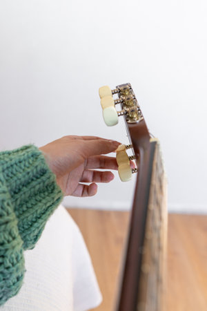 A woman playing a guitarの写真素材