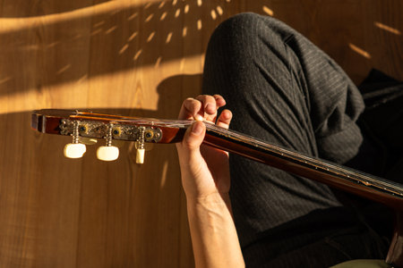 A woman playing a guitar