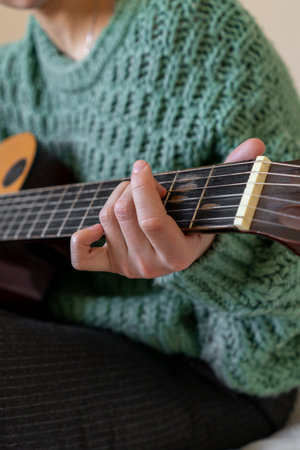 A woman playing a guitarの写真素材