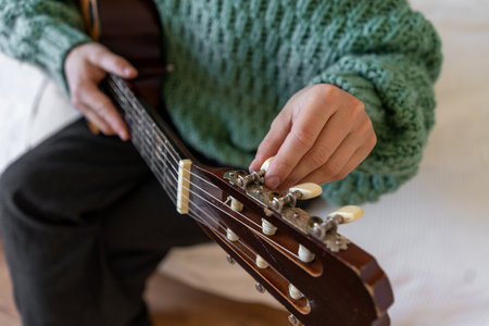 A woman playing a guitarの写真素材