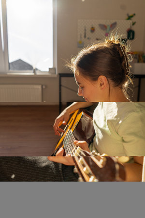 A woman playing a guitarの写真素材