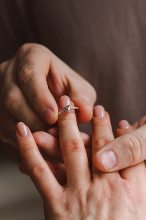 The man made an offer of his hand and heart to the girl. Romantic gesture.