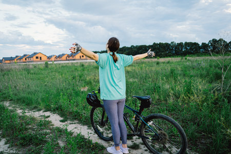 Woman in Blue Shirt Resting After Cyclingの写真素材