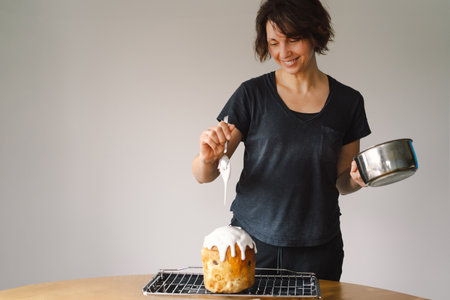 Baking a festive easter panettone with icing on a kitchen countertop during springtime preparations