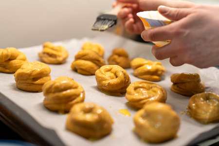 Woman prepares dough for bakingの写真素材