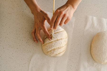 Woman preparing sourdough bread at homeの写真素材