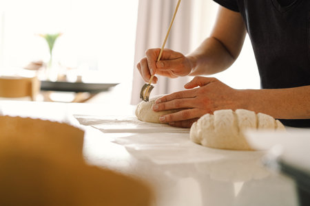 Woman preparing sourdough bread at homeの写真素材
