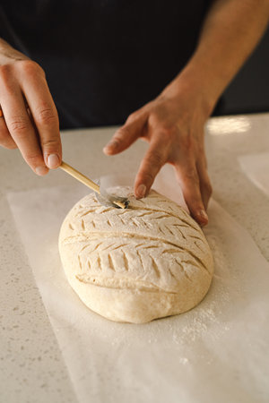 Woman preparing sourdough bread at homeの写真素材
