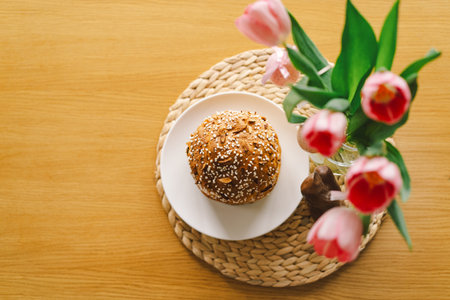 Stylish easter cake, eggs on a table with spring flowers.の写真素材