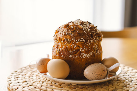 Baking a festive easter panettone with icing on a kitchen countertop during springtime preparationsの写真素材