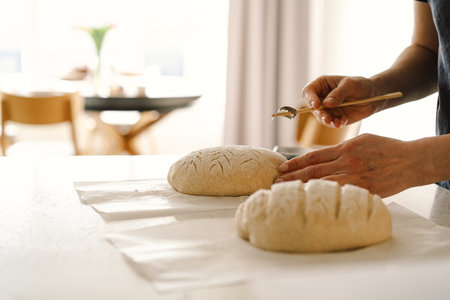 Woman preparing sourdough bread at homeの写真素材