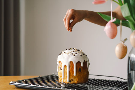 Baking a festive easter panettone with icing on a kitchen countertop during springtime preparations