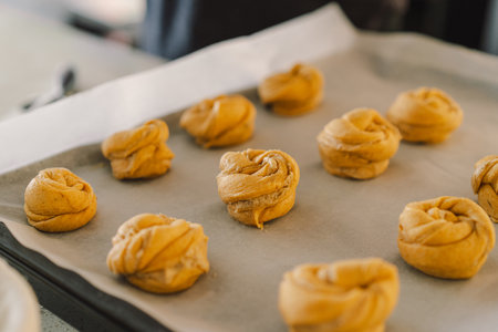 Woman prepares dough for bakingの写真素材