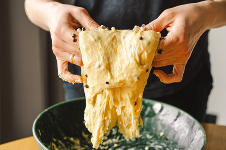 Woman prepares dough for bakingの写真素材
