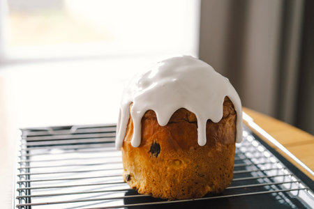 Baking a festive easter panettone with icing on a kitchen countertop during springtime preparations