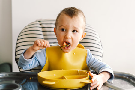 Little child with solid nutrition.の写真素材