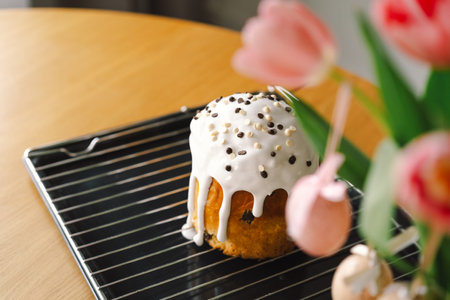 Baking a festive easter panettone with icing on a kitchen countertop during springtime preparationsの写真素材