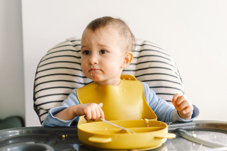 Little child with solid nutrition.の写真素材
