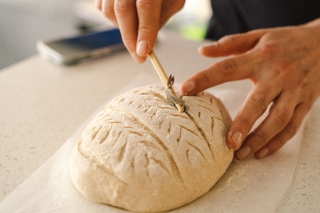 Woman preparing sourdough bread at homeの写真素材