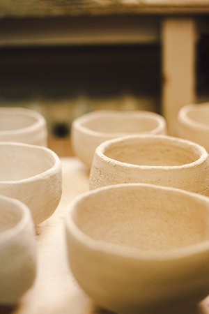 Crafting simple ceramic pots in a pottery studioの写真素材