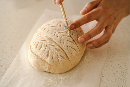 Woman preparing sourdough bread at homeの写真素材