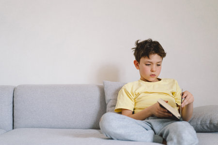 Boy reading an interesting book