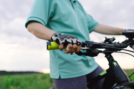 Close Up of a Womans Hand on a Mountain Bike Handlebars