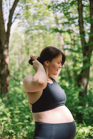 Pregnant woman doing fitness outdoors.の写真素材