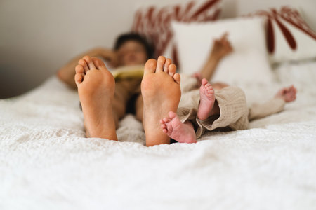 Two pairs of feet two little boys brothersの写真素材