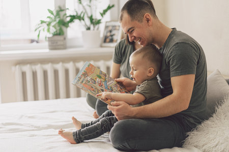Family Love. Parents and Little Son Reading Book Together