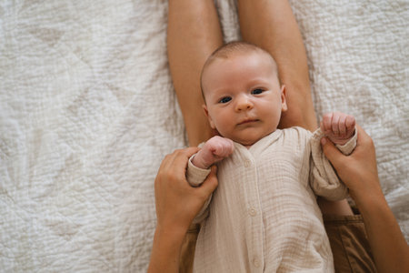 Two brothers enjoying playing in cozy bright bedroomの写真素材