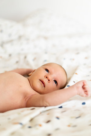 A newborn baby lying on a blanketの写真素材