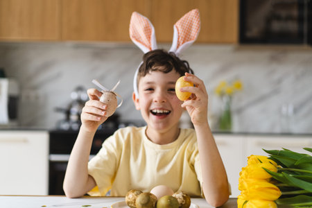 Smiling child wearing bunny ears with natural Easter eggs at home kitchen