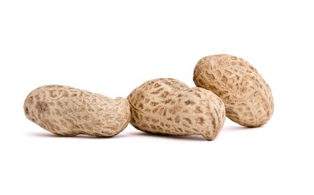 three peanuts on isolated backgroundの写真素材
