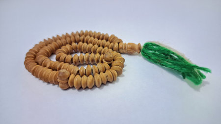 Wooden Islamic Prayer Beads Isolated on White Background  High-Resolution Photo of Muslim Worship Accessory with Natural Texture and Detailの写真素材