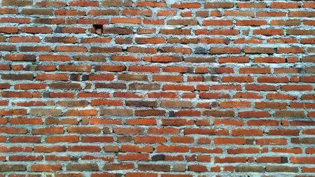 Solid Red Brick Wall with Uneven Texture and Visible Mortar, Authentic Construction Detail for...