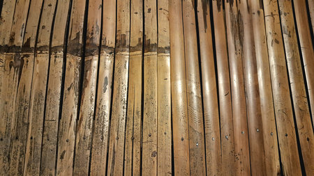 Rustic Bamboo Bench Texture with Cozy Nighttime Glow, Perfect for Vintage and Retro Backgrounds, Wallpapers, or Craft Designs in High-Definition for a Timeless Antique Lookの写真素材