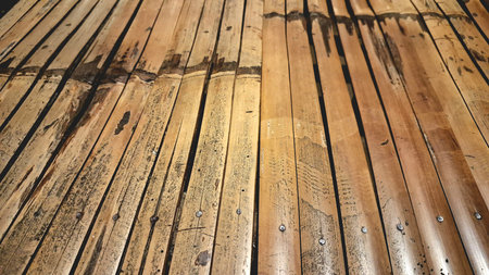 Rustic Bamboo Bench Texture with Cozy Nighttime Glow, Perfect for Vintage and Retro Backgrounds, Wallpapers, or Craft Designs in High-Definition for a Timeless Antique Lookの写真素材