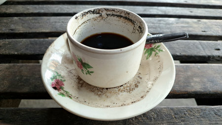 Coffee grounds grains that stick to the edge of the cup. Typical Indonesian Javanese Coffee. Original coffee with simple processingの写真素材