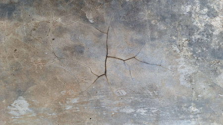 Weathered grunge concrete wall with distressed cement texture, rough aged stone surface for design elementsの写真素材