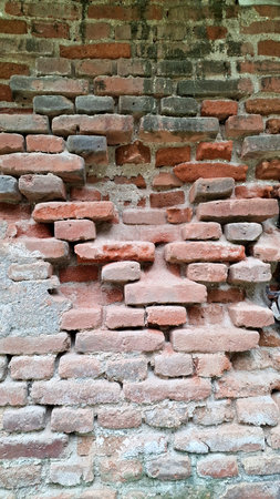 Weathered red brick wall texture with aged cement joints and a grungy, rustic look. Perfect for...
