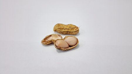 Peanuts Arachis hypogaea groundnut macro isolated on white background top view healthy protein snack food allergy concept imageの写真素材