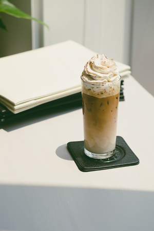 Ice coffee on white tableの写真素材