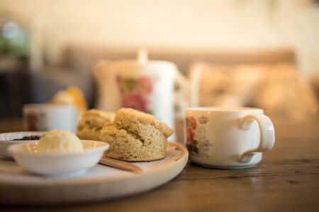 Close up Scones with butter and tea on the table.の写真素材