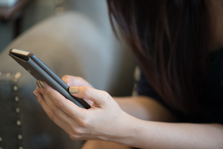 Asian woman holding smart phone.の写真素材