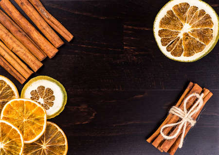 Dried slices of orange, lemon on a black backgroundの写真素材