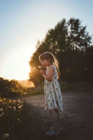 Mom and daughter play summer on the beachの写真素材