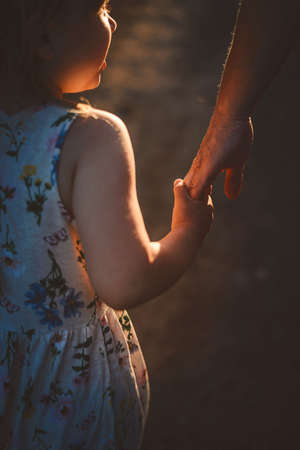 Mom and daughter play summer on the beachの写真素材