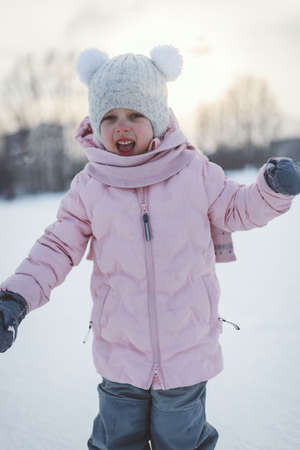 a joyful child in winter to skate on skates happyの写真素材