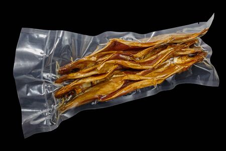 vacuum packed cold smoked Baikal omul on the black backgroundの写真素材